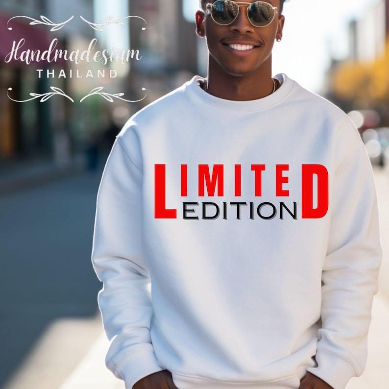 May include: White sweatshirt with the words "LIMITED EDITION" printed in red and black letters.