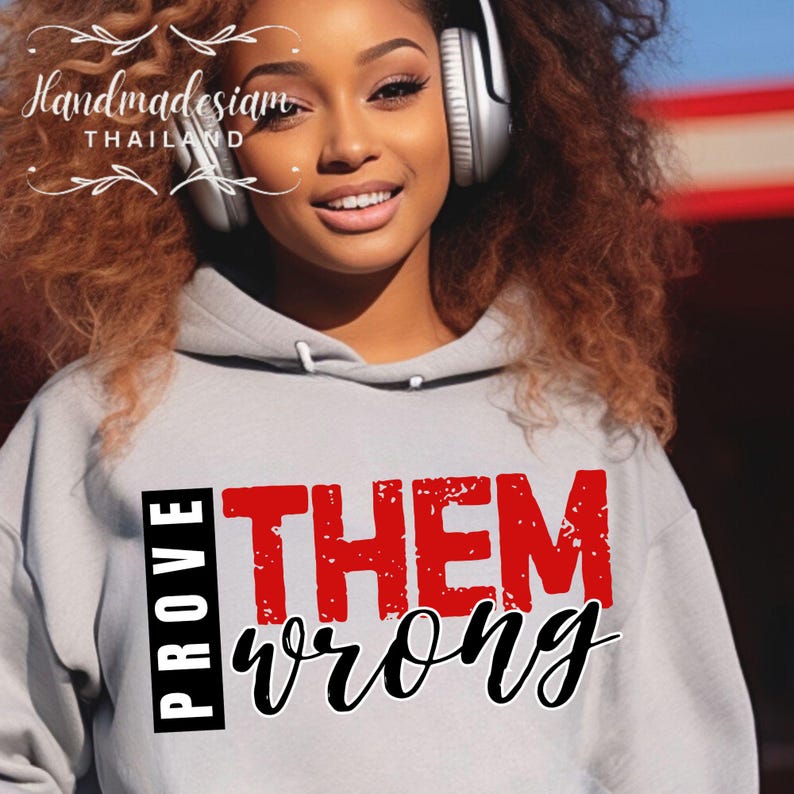 May include: A gray hoodie with the text "PROVE THEM WRONG" in red and black lettering. The text is in a distressed font style.