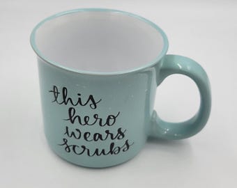 Dayna Lee "This Hero Wears Scrubs" Coffee Mug, Tea Mug, Single Mug, Gift for Medical Professional, 18 ounces