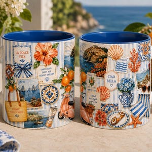 May include: Two ceramic mugs with a blue interior and handle, featuring a collage print of Mediterranean-themed illustrations including oranges, a scooter, a straw bag, seashells, and text reading La Dolce Vita, Capri, and Ciao Bella.