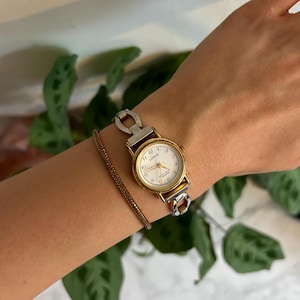 Montre à quartz bicolore Lorus argentée et dorée pour femme vintage