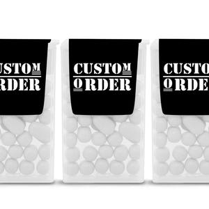 May include: Three clear rectangular plastic containers filled with small white candies. Each container features a black label at the top with the white text CUSTOM ORDER printed in a bold, serif font, with horizontal lines above and below the word CUSTOM.
