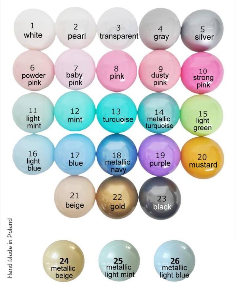 May include: Chart of 26 different colored beads, numbered 1 through 26. The beads are arranged in rows of five, with the numbers and names of the colors written below each bead. The colors include white, pearl, transparent, gray, silver, powder pink, baby pink, pink, dusty pink, strong pink, light mint, mint, turquoise, metallic turquoise, light green, light blue, blue, metallic navy, purple, mustard, beige, gold, black, metallic beige, metallic light mint, and metallic light blue.