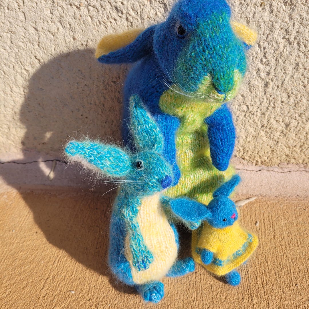 Hand-knitted Family of Blue Rabbits. Design by Claire Garland ...