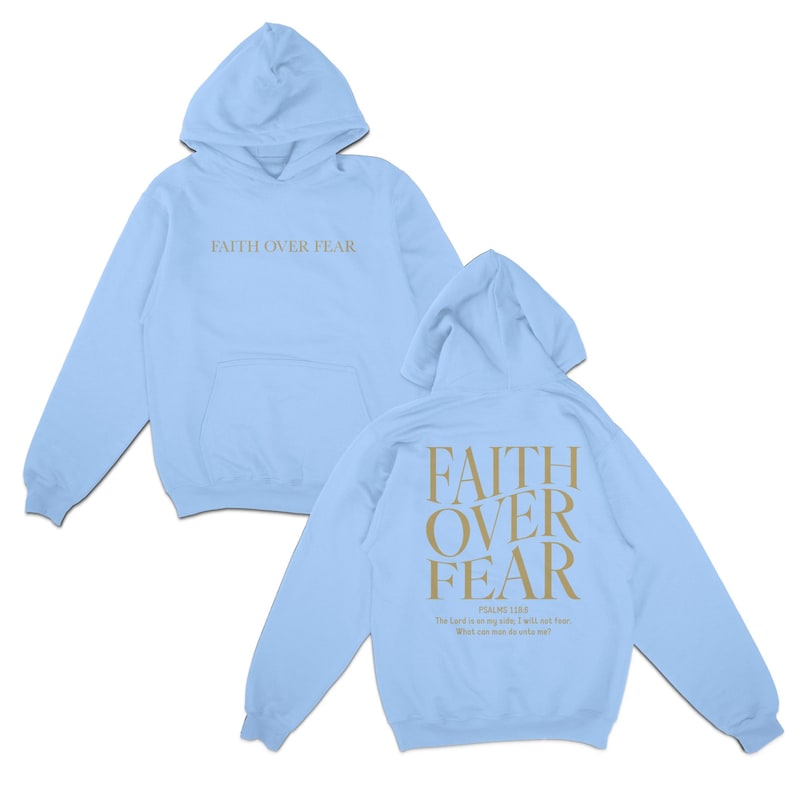 May include: Light blue hoodie with the text "FAITH OVER FEAR" printed on the front and back. The back also includes the text "PSALM 56:3" and a quote from the Bible: "The Lord is my helper; I will not fear. What can man do to me?"