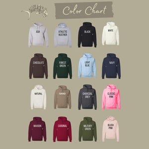 May include: Color chart showing 16 different hoodie colors. The colors are: Ash, Athletic Heather, Black, White, Chocolate, Forest Green, Light Blue, Navy, Natural, Sand, Charcoal Grey, Classic Pink, Maroon, Cardinal, Military Green, and Blush Pink.