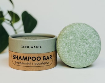 May include: A green shampoo bar in a cardboard container with the text "ZERO WASTE SHAMPOO BAR peppermint + eucalyptus".