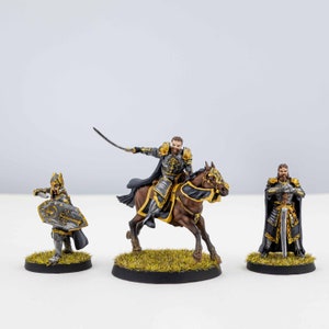 May include: Three miniature figures painted in a fantasy style. A knight on horseback, a knight with a sword, and a knight with a shield. The figures are painted in gold, silver, and black.