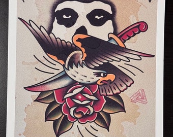 May include: A vintage-style tattoo flash print featuring a black and white skull with a hawk flying above it, holding a dagger in its talons. The hawk is perched on a red rose with green leaves. The print has a brown background with a faded look and the text "I ain't no goddamn son of a bitch".