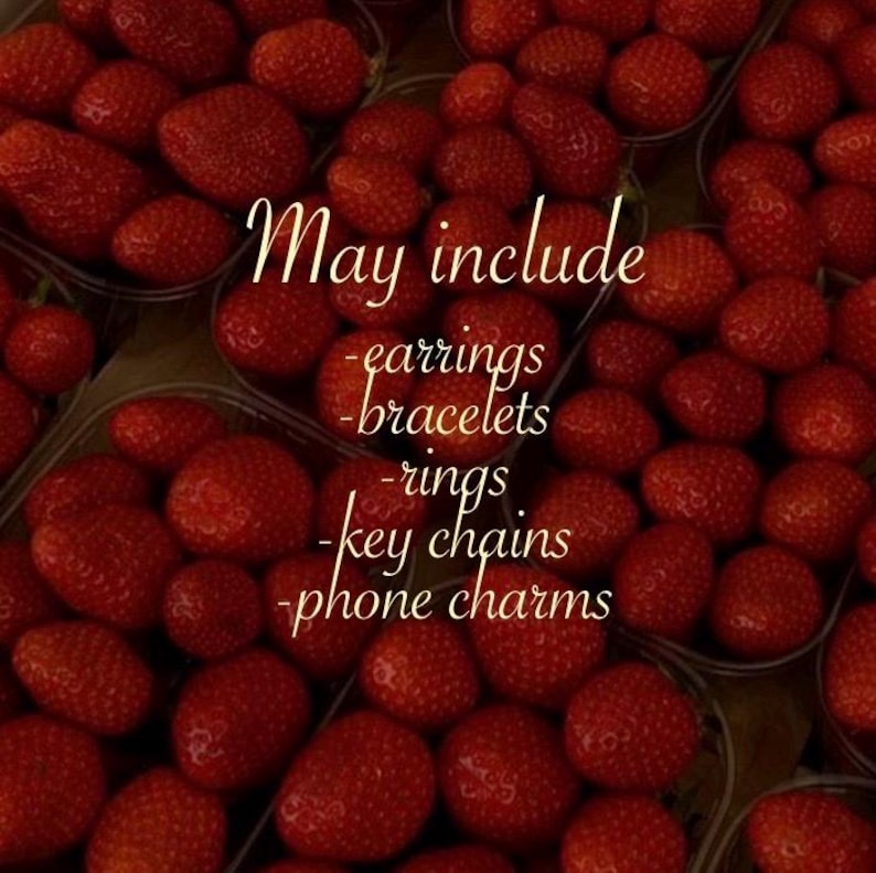 May include: A close-up of fresh, ripe strawberries in clear plastic containers. The image includes text that reads "May include - earrings - bracelets - rings - key chains - phone charms."