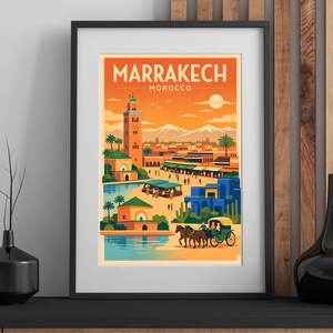 May include: Framed art print featuring a stylized illustration of Marrakech, Morocco. The artwork depicts a cityscape with a minaret, palm trees, and a horse-drawn carriage, set against an orange and yellow sky. The word "MARRAKECH" is at the top.