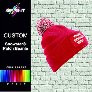 May include: Red beanie with a white pom pom and a patch that says "Your Design Here".