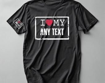 May include: Black t-shirt with a white rectangular design that reads "I ❤️ MY ANY TEXT" in white text with a red heart. The same text is also printed on the left sleeve. The shirt is made of a soft material.