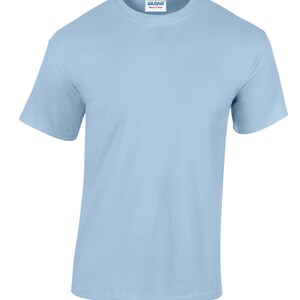 May include: A light blue t-shirt with a Gildan Heavy Cotton label on the front.