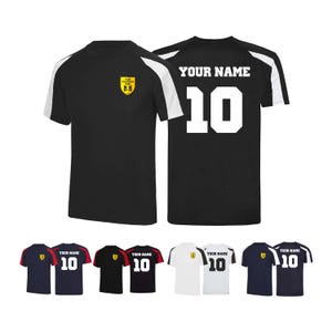 May include: Black athletic jersey with white shoulder stripes and the text "YOUR NAME" and the number "10" on the back. The front features a crest and the text "YOUR CLUB NAME HERE". Additional jerseys in various colors are displayed below.