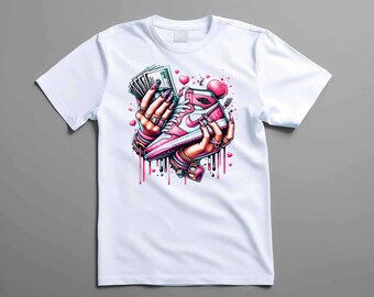 May include: White t-shirt with a graphic print of a pink and white sneaker, cash, and hearts. The graphic has a dripping paint effect.