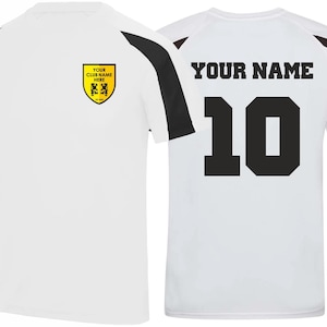 May include: White athletic jersey with black and brown accents. The jersey features a yellow crest with text "YOUR CLUB NAME HERE" and a number 10 on the back. The text "YOUR NAME" is above the number.