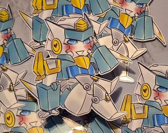 May include: A collection of die-cut stickers featuring a stylized robot character with white, blue, and yellow armor. The robot has a blushing face, blue eyes, and a circular yellow emblem with a small heart on each side of its head.