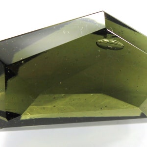 Faceted natural Czech moldavite from locality MALOVICE, found in 2023, size 24x15x12mm, 23.85 carats, yellowish green color (code: šp 19/45)