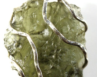 Pendant! Genuine Czech moldavite from locality CHLUM - 2021, in a silver (Ag 925) cage, 2.23 gram, stone size 18x15x5mm, lighter green color