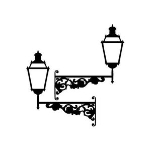 May include: Two black metal lamp brackets with ornate scrollwork designs. Each bracket has a single black metal lamp with a clear glass shade.