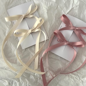 set of two satin long tail bows for pig tail hair style