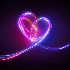 May include: A glowing pink and blue heart shape created with light trails on a dark background.