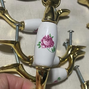 Vintage cabinet drawer pulls set of 16 polished brass finish with white ceramic center & pink rose design.