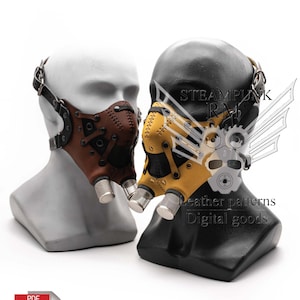 May include: Two steampunk-style leather masks on mannequin heads. The mask on the left is brown with silver accents. The mask on the right is yellow with black accents. Both masks have a steampunk-style design with gears and pipes.