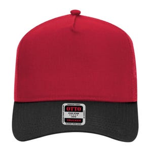 May include: A red and black trucker hat with a mesh back. The hat features a red front panel and a black brim. The hat has a snap closure and a small tag that reads "OTTO TRUCKER CLASSIC MESH BACK".