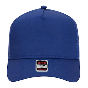 May include: A royal blue trucker hat with a mesh back and a snap closure. The hat features a curved brim and a small, round button on top. A white label with black text reads "OTTO" and "TRUCKER".