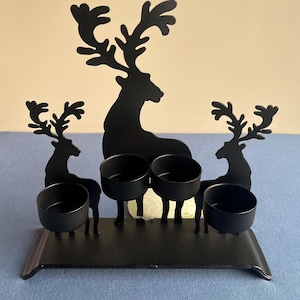 Preowned / un used / rustic wrought iron reindeer candle holder made in Philippines