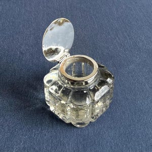 vintage preowned clear cut glass with brass hinged cap inkwell in silver finish