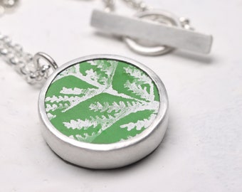 Green leaf hand printed anodised aluminium and silver round pendant necklace