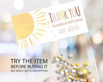 May include: A white thank you tag with a yellow sun and rays. The text reads "Thank you for making my party so bright. Love, Olivia."