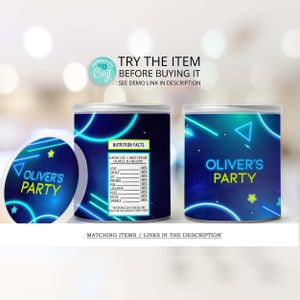 May include: Two blue and black party favor containers with neon green and blue accents. The containers have a space theme with stars and a triangle. One container has the text "Oliver's Party" and the other has a nutrition facts label with the text "Oliver's Party".