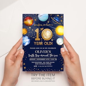 May include: A blue and gold birthday invitation with a space theme. The invitation features a large gold number 10 with planets and stars. The text reads "Houston, we have a 10 year old!" and "Oliver's tenth trip around the sun".