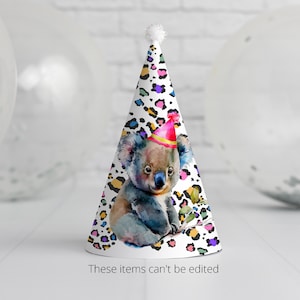 May include: A white party hat with a colorful leopard print design. A koala wearing a pink and yellow party hat is featured on the front of the hat.