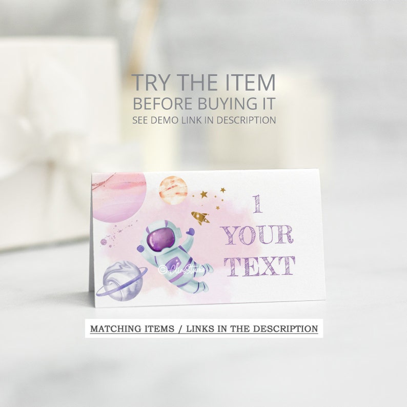 May include: A printable card with a watercolor illustration of an astronaut floating in space with planets and stars. The card has the text "1 YOUR TEXT" on it.