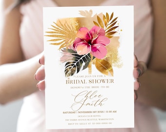 May include: Bridal shower invitation with a floral design. The invitation features a pink hibiscus flower, gold accents, and text that reads "Please join us for a Bridal Shower". The invitation includes the bride's name, date, time, and location.