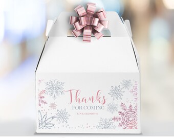 May include: White favor box with a pink bow on top. The box is decorated with silver and pink snowflakes and the text "Thanks for Coming". The text "Love, Elizabeth" is also included.