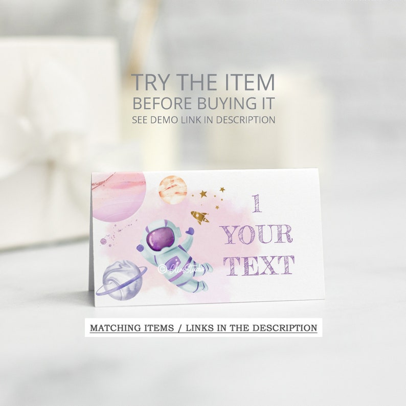 May include: A printable card with a watercolor illustration of an astronaut in space with planets and stars. The card has the text "1 YOUR TEXT" on it.