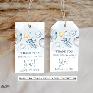 May include: Two blue and white thank you tags with an astronaut and planets. The text reads "Thank you! For making my party a blast. Love, Oliver."