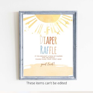 Puede incluir: Un sol amarillo y naranja con rayos y estrellas, con el texto "DIAPER RAFFLE" en letras de colores. El texto de abajo dice "IF YOU BROUGHT A PACK OF DIAPERS FOR THE RAFFLE, PLEASE PLACE YOUR TICKET HERE! good luck!"