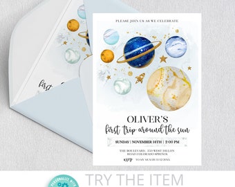 May include: A blue and gold space-themed baby shower invitation with planets, stars, and a rocket ship. The text reads "Oliver's first trip around the sun" and includes the date and time of the event.