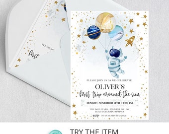 May include: A blue and gold astronaut holding balloons shaped like planets. The text "Oliver's first trip around the sun" is on the invitation. The invitation is for a baby shower.