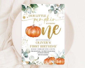 May include: A printable invitation for a first birthday party with a pumpkin theme. The invitation features a watercolor illustration of pumpkins, leaves, and gold glitter. The text on the invitation reads "Our Little Pumpkin is Turning One" and includes the child's name, date, time, and location of the party.