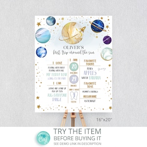 May include: A blue and gold space-themed growth chart for a baby boy. The chart features planets, stars, and a rocket ship. It includes the baby's name, Oliver, and details about his first year, such as his weight, height, favourite foods, and toys. The chart is 16 inches by 20 inches.