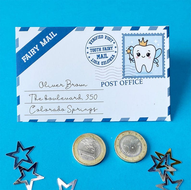 May include: A white envelope with "FAIRY MAIL" printed on a blue diagonal stripe. The envelope has a stamp with a cartoon tooth fairy and the text "TOOTH FAIRY MAIL". Two coins and star-shaped confetti are on a blue background.