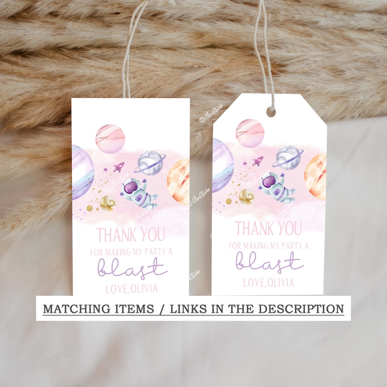 May include: Two pink and white thank you tags with an astronaut and planets. The text reads "Thank you for making my party a blast Love, Olivia".